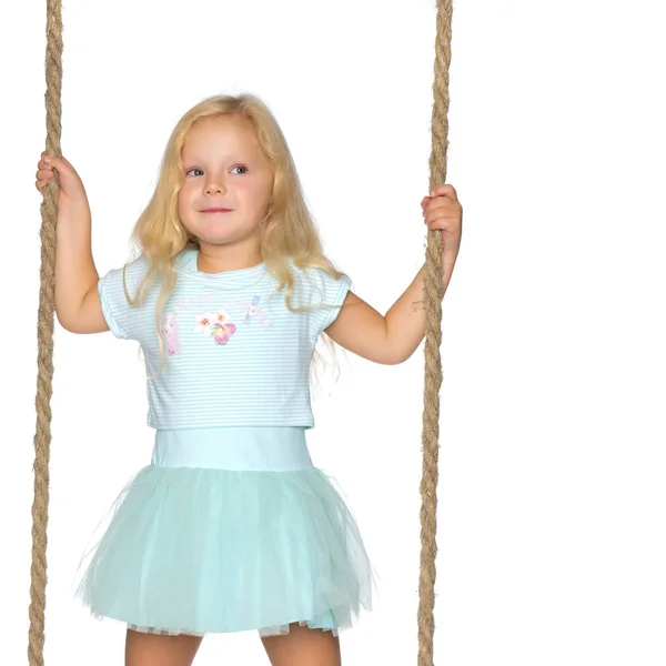 Little girl swinging on a swing — Stock Photo, Image