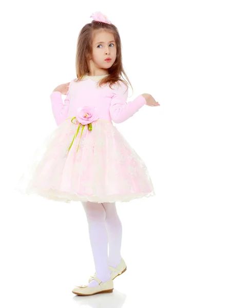 Elegant little girl in a pink dress. — Stock Photo, Image