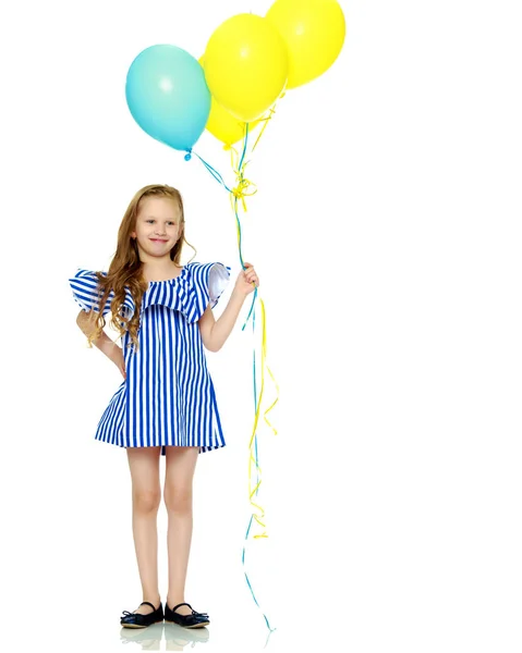 Adorable little blond girl in very short summer striped dress. — Stock Photo, Image