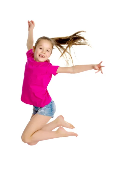 Meisje gymnast springen. Rechtenvrije Stockafbeeldingen