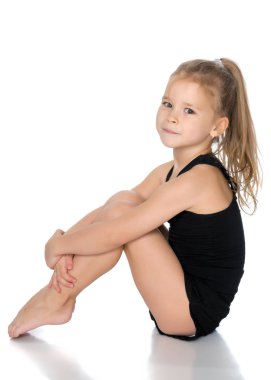 Jimnastikçi egzersizi yapmaya hazırlanıyor..