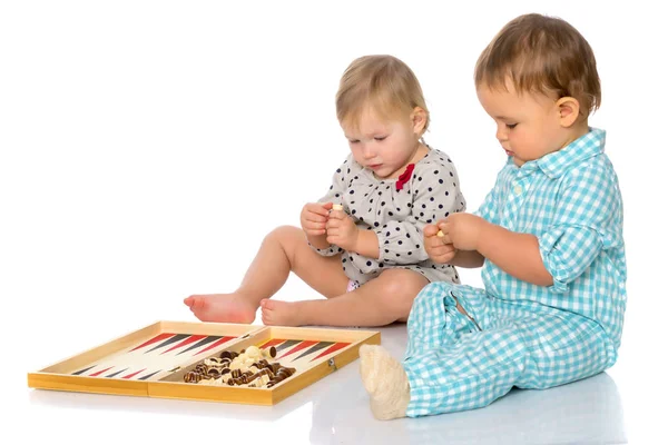 Children play chess and backgammon. — Stock Photo, Image