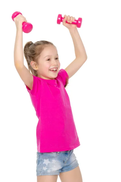 Niña haciendo ejercicios con pesas. —  Fotos de Stock