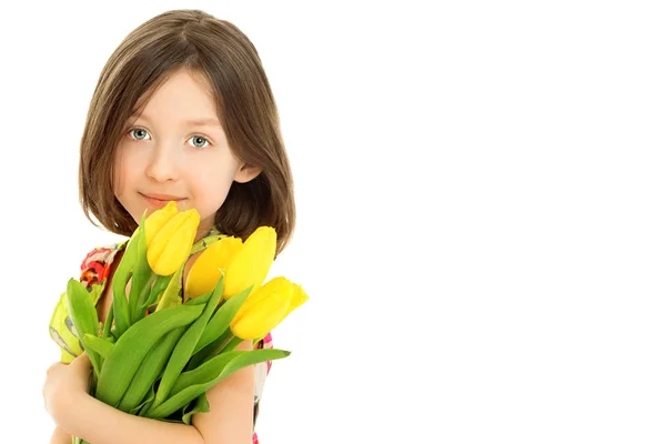 Little girl with a bouquet of flowers — Stock Photo, Image