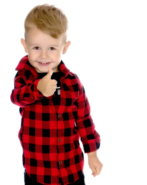 Un niño está levantando un dedo . —  Fotos de Stock