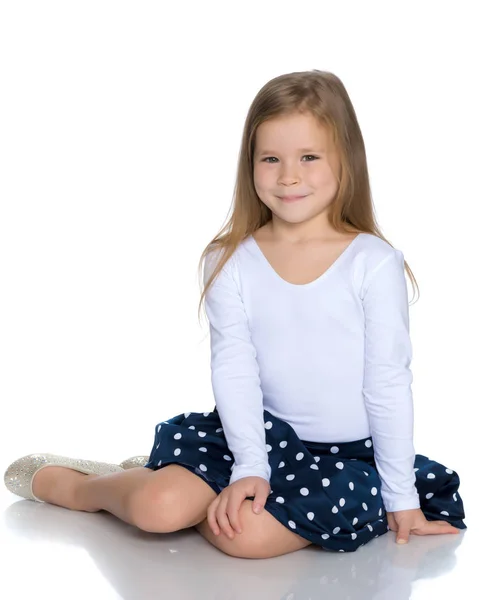 Little girl is sitting on the floor. — Stock Photo, Image