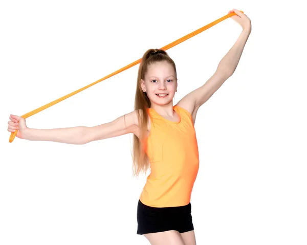 A girl gymnast performs exercises with a skipping rope. — Stock Photo, Image