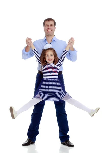 Dad holding daughters hands. — Stock Photo, Image