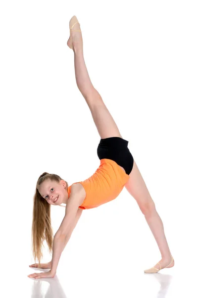 The gymnast perform an acrobatic element on the floor. — Stock Photo, Image