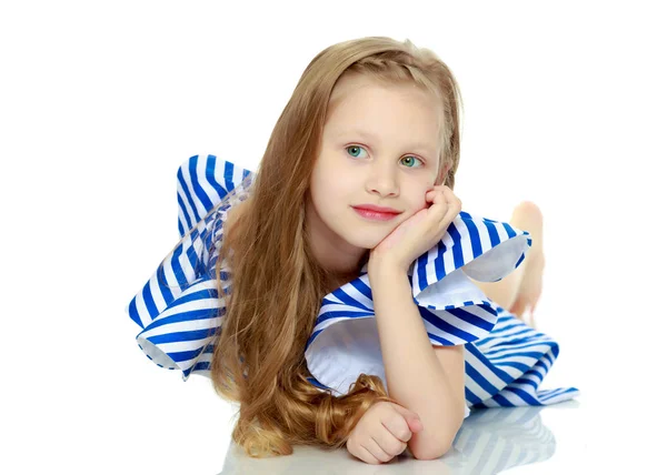 Adorable little blond girl in very short summer striped dress.Sh — Stock Photo, Image