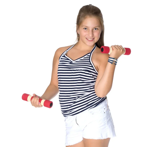 Teenage girl with dumbbells in hands — Stock Photo, Image