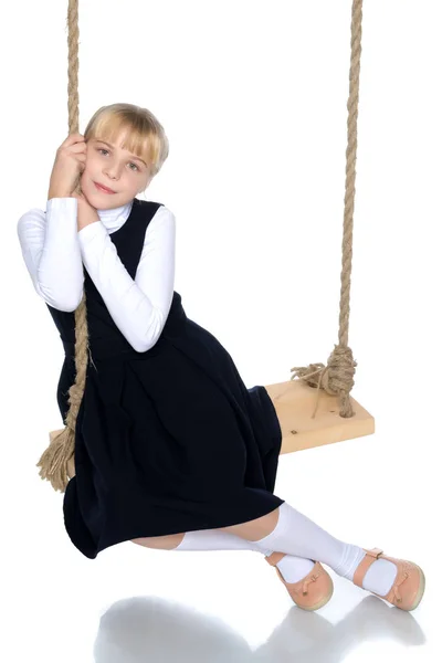 Little girl swinging on a swing — Stock Photo, Image