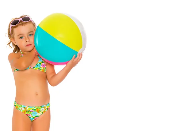 Little girl in a swimsuit with a ball — Stock Photo, Image