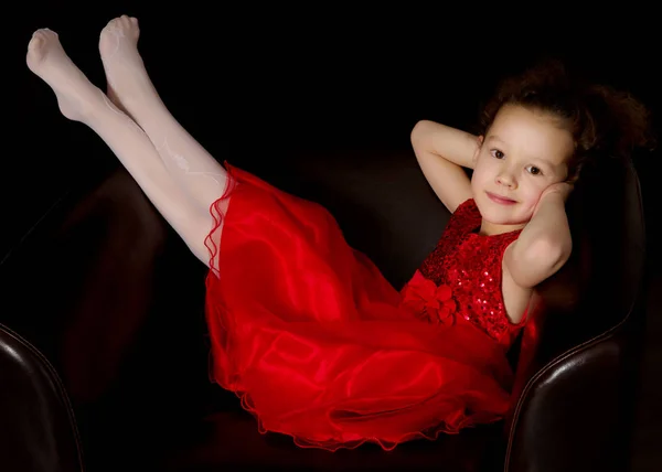 Little girl on a black background — Stock Photo, Image