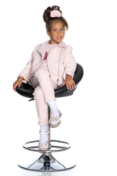 Little girl on a swivel chair — Stock Photo, Image