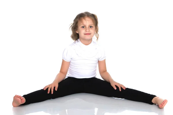 Little girl is sitting on the floor. — Stock Photo, Image