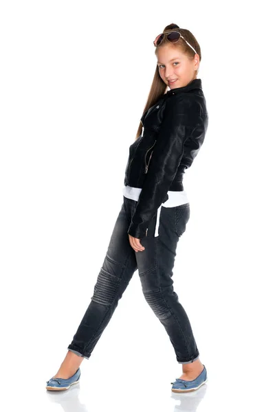 A teenage girl in a leather jacket and jeans. — Stock Photo, Image