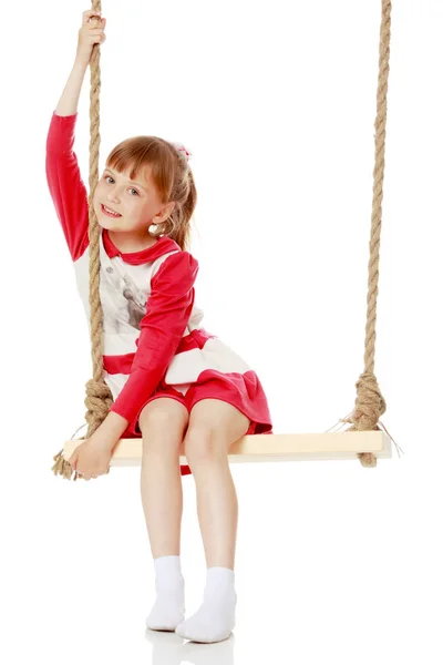 Little girl swinging on a swing — Stock Photo, Image