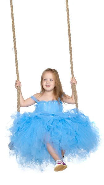 Little girl swinging on a swing — Stock Photo, Image