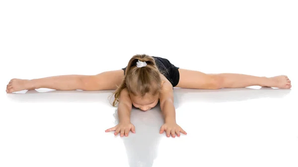 The gymnast perform an acrobatic element on the floor. — Stock Photo, Image