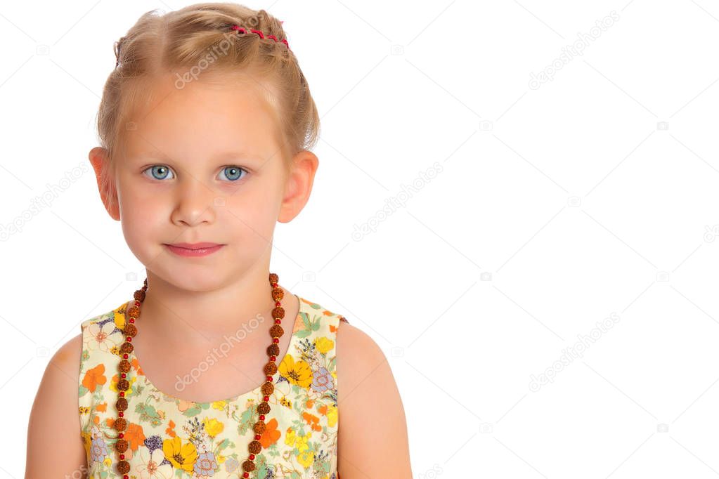 Fashionable little girl in beads.