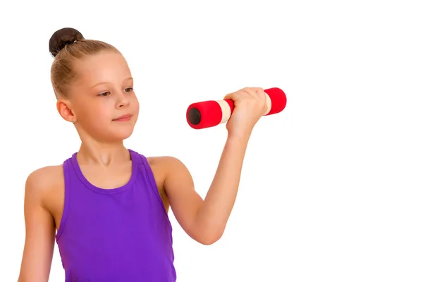 Little girl doing exercises with dumbbells. — Stock Photo, Image