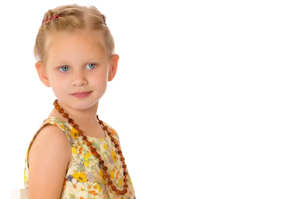 Fashionable little girl in beads. — Stock Photo, Image