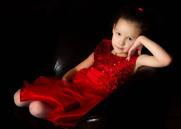 Little girl on a black background — Stock Photo, Image