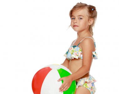 Little girl in a swimsuit with a ball clipart