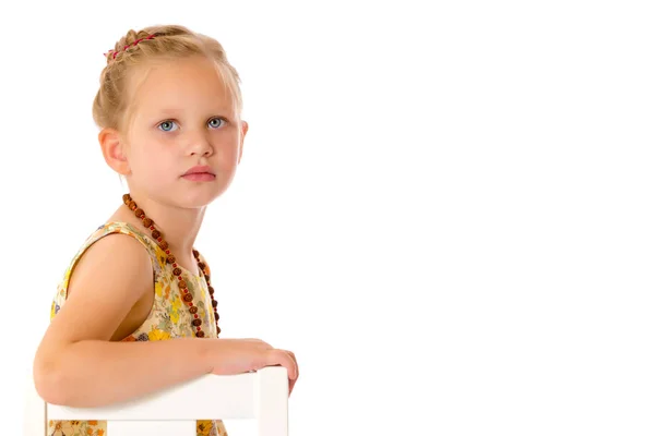 Fashionable little girl in beads. — Stock Photo, Image