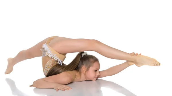 The gymnast perform an acrobatic element on the floor. — Stock Photo, Image