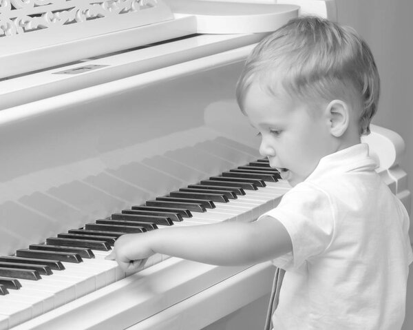 Little boy playing the piano