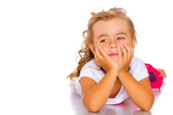 Little girl lies on the floor — Stock Photo, Image