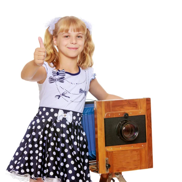 Little girl holding her thumb up — Stock Photo, Image