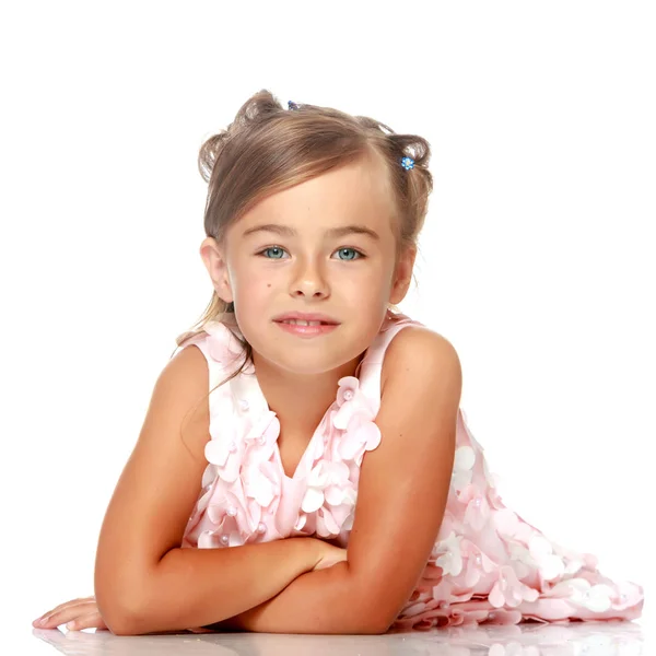 Little girl lies on the floor — Stock Photo, Image