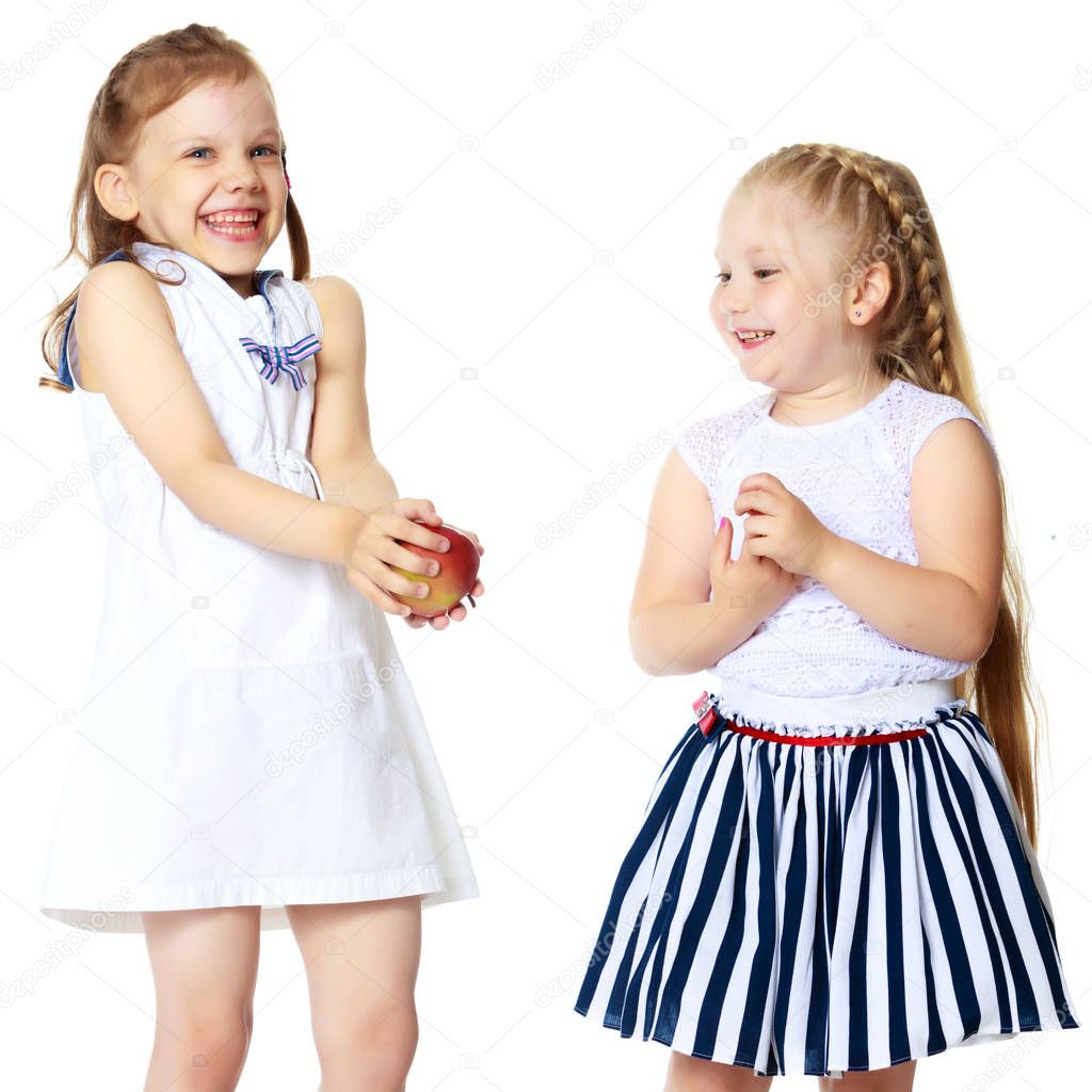 two little girls with an apple
