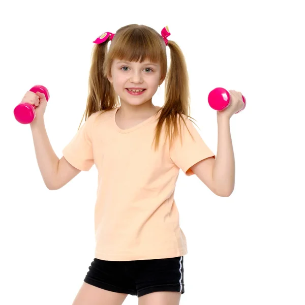 Menina fazendo exercícios com halteres. — Fotografia de Stock