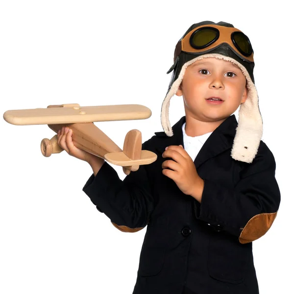 Menino com um avião de madeira . — Fotografia de Stock