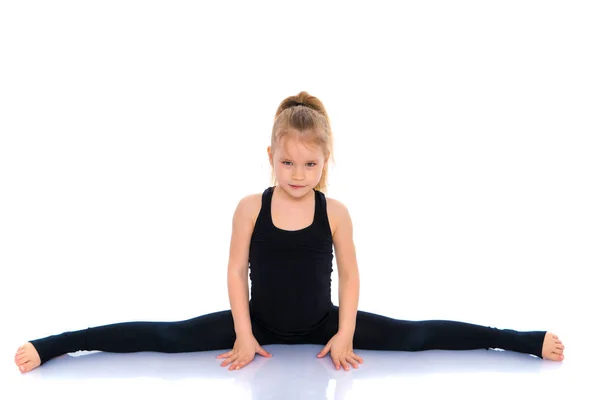 Chica gimnasta realizar el ejercicio de cuerda . — Foto de Stock