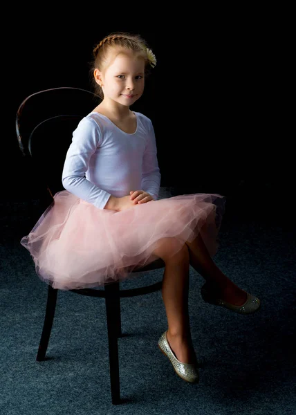 Little girl on a black background — Stock Photo, Image