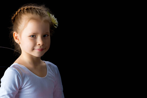 Little girl on a black background