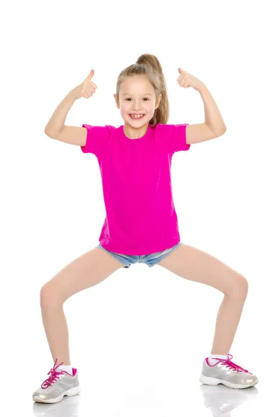 Niña sosteniendo su pulgar hacia arriba — Foto de Stock