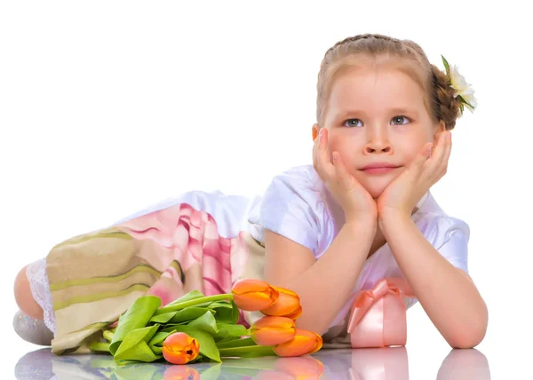 Little girl with a bouquet of flowers — Stock Photo, Image