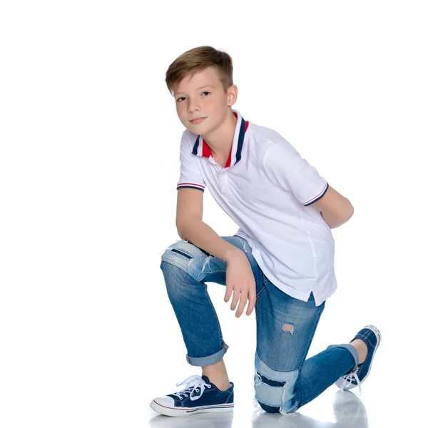 Fashionable boy teen sitting on the floor. — Stock Photo, Image