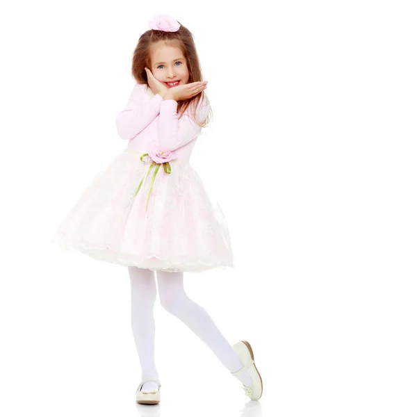 Elegant little girl in a pink dress. — Stock Photo, Image