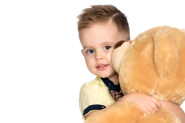 Little boy playing with teddy bear — Stock Photo, Image