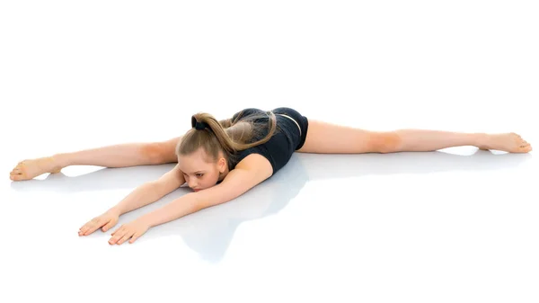 Girl gymnast perform the twine exercise. — Stock Photo, Image