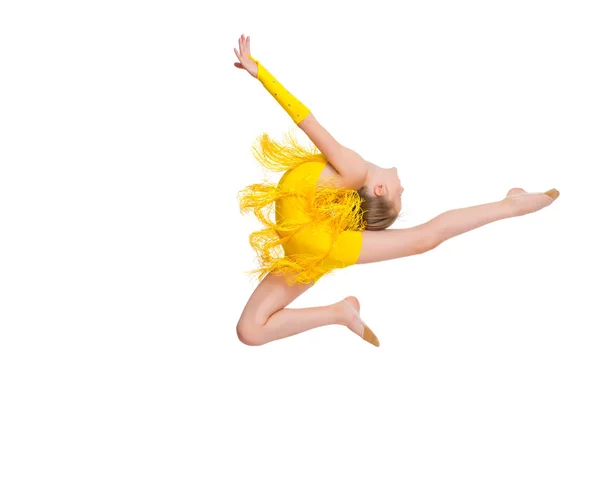 The girl gymnast performs a jump. — Stock Photo, Image