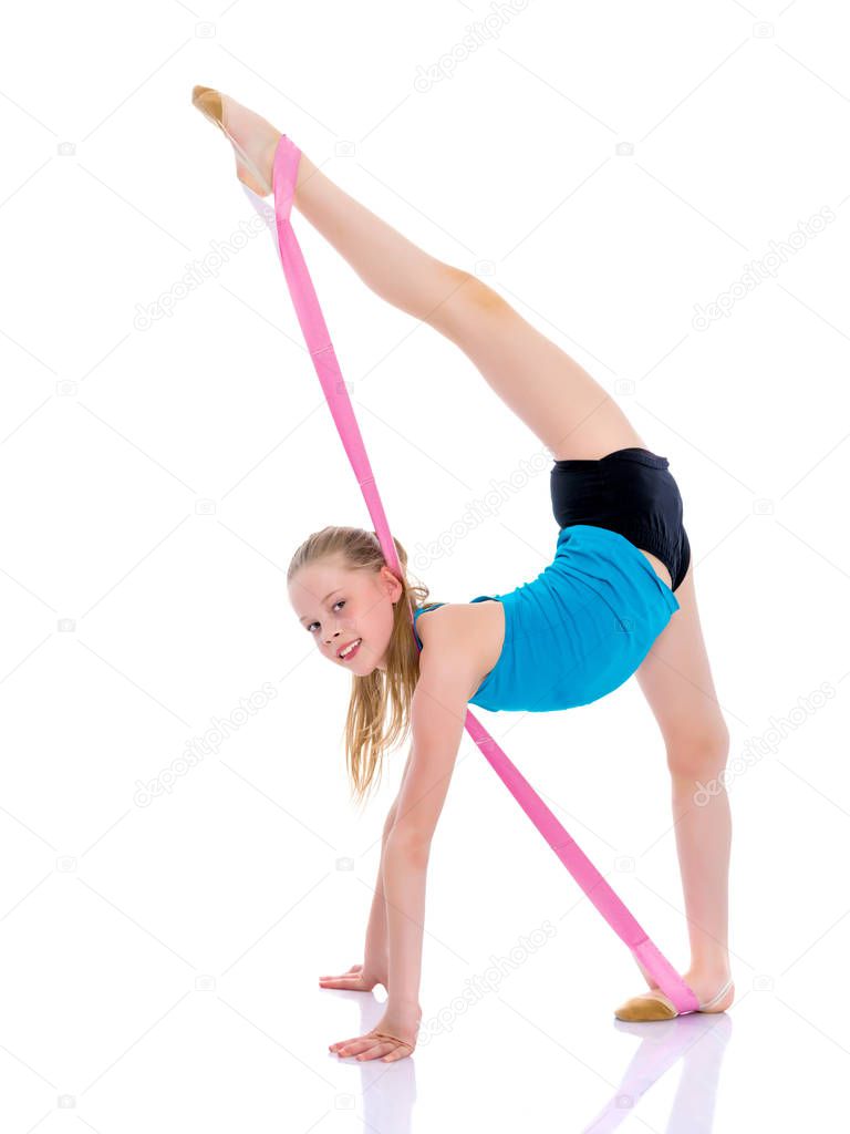 The gymnast perform an acrobatic element on the floor.