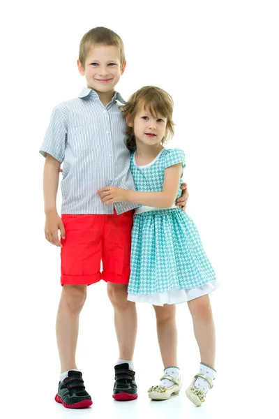 Brother and sister, boy and girl posing in the studio. Friendshi — Stock Photo, Image